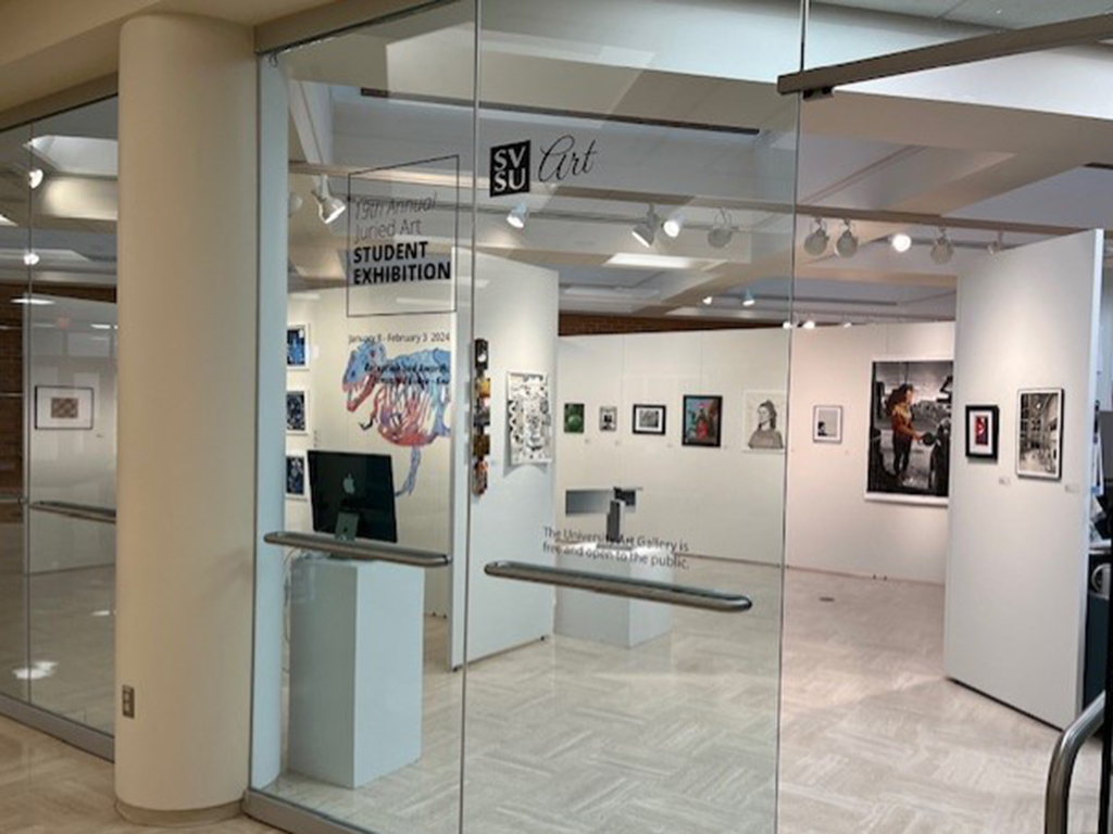 Entrance to the 19th Annual Juried Art Student Exhibition with various works of art shown